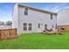 Large backyard with a wooden deck, seating area, grill and lush green grass at 336 Freeman Cir, Villa Rica, GA 30180