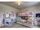 Bright bedroom featuring a bunk bed, a desk area and a window that provides plenty of natural light at 336 Freeman Cir, Villa Rica, GA 30180
