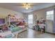 Spacious bedroom showcasing a bunk bed, desk and windows that provide plenty of natural light at 336 Freeman Cir, Villa Rica, GA 30180