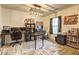 A well-lit home office with dual desks, ergonomic chairs and stylish decor, perfect for remote work or creative projects at 336 Freeman Cir, Villa Rica, GA 30180