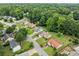 Birds eye view of the property in a neighborhood setting with tree lined streets and landscaped yards at 467 Ravinia Way, Lawrenceville, GA 30044