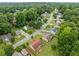 Overhead aerial view of the property in a peaceful neighborhood, surrounded by mature trees and green spaces at 467 Ravinia Way, Lawrenceville, GA 30044