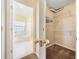 Bathroom with tub, shower, tile floor and walk-in closet at 467 Ravinia Way, Lawrenceville, GA 30044