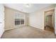 Neutral bedroom with carpet, window and a closet at 467 Ravinia Way, Lawrenceville, GA 30044