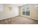 Neutral bedroom with carpet, large window, and shelves at 467 Ravinia Way, Lawrenceville, GA 30044