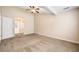 Spacious bedroom with carpeted floor, ceiling fan, and access to the en-suite bathroom at 467 Ravinia Way, Lawrenceville, GA 30044