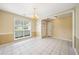 Inviting dining room with tiled floors, a chandelier, and ample natural light at 467 Ravinia Way, Lawrenceville, GA 30044