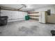 Garage with shelving, refrigerator, and lots of space at 467 Ravinia Way, Lawrenceville, GA 30044