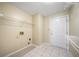 Functional laundry room with tile flooring and plenty of space for appliances at 467 Ravinia Way, Lawrenceville, GA 30044