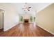A spacious living room featuring a fireplace, hardwood floors, vaulted ceilings and great natural light at 467 Ravinia Way, Lawrenceville, GA 30044