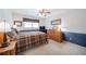 Cozy bedroom with a ceiling fan, a queen-size bed, and ample natural light from the window at 5778 Little Oak Trl, Stone Mountain, GA 30087