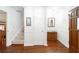 Bright foyer with hardwood floors, staircase, and classic wainscoting at 5778 Little Oak Trl, Stone Mountain, GA 30087
