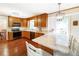 Bright kitchen featuring a breakfast bar with granite countertops and hardwood floors at 5778 Little Oak Trl, Stone Mountain, GA 30087