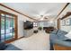 Comfortable living room with brick fireplace, and a view of the pool area at 5778 Little Oak Trl, Stone Mountain, GA 30087