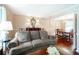 Bright living room with classic decor, hardwood floors, and dining area access at 5778 Little Oak Trl, Stone Mountain, GA 30087