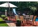 Outdoor seating area with in-ground pool and slide, plus an outdoor dining table and chairs at 5778 Little Oak Trl, Stone Mountain, GA 30087