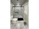 Modern bathroom features a glass shower with marble tile and sleek fixtures at 2166 Lake Ridge Ter, Lawrenceville, GA 30043