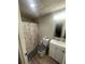 Cozy bathroom with a shower-tub combo, neutral colors, and a modern vanity at 2166 Lake Ridge Ter, Lawrenceville, GA 30043