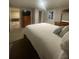 Bedroom with natural light, wood furniture, and an ensuite bath and closet at 2166 Lake Ridge Ter, Lawrenceville, GA 30043