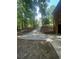Long driveway extending to the garage with a brick wall border at 2166 Lake Ridge Ter, Lawrenceville, GA 30043