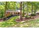 Charming brick home with mature trees and landscaped front yard at 2166 Lake Ridge Ter, Lawrenceville, GA 30043