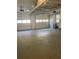Spacious garage with storage racks and overhead door at 2166 Lake Ridge Ter, Lawrenceville, GA 30043