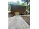 Rear exterior of home showing the brickwork, garage, and outdoor staircase at 2166 Lake Ridge Ter, Lawrenceville, GA 30043