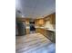 Well-lit kitchen featuring stainless steel appliances and ample counter space at 2166 Lake Ridge Ter, Lawrenceville, GA 30043