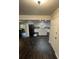 Updated kitchen with white cabinets, granite countertops, and stainless steel appliances at 2166 Lake Ridge Ter, Lawrenceville, GA 30043