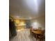Open kitchen and dining area with stainless steel appliances and wood cabinetry at 2166 Lake Ridge Ter, Lawrenceville, GA 30043