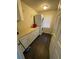 Functional laundry room with front-loading washer and dryer and ample counter space at 2166 Lake Ridge Ter, Lawrenceville, GA 30043