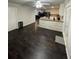 Open concept living space with updated kitchen, wood floors, and neutral paint at 2166 Lake Ridge Ter, Lawrenceville, GA 30043