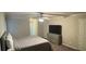 Relaxing main bedroom with neutral tones, a ceiling fan, a large tv, and modern fixtures at 2166 Lake Ridge Ter, Lawrenceville, GA 30043