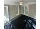 The sunroom has a ceiling fan and a brick wall at 2166 Lake Ridge Ter, Lawrenceville, GA 30043