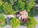 Bird's-eye view of a house with lush greenery and mature trees surrounding the property at 4750 Freeport Bay Ne, Roswell, GA 30075