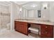 Bathroom featuring a granite countertop vanity, a large mirror, and a walk-in shower at 4750 Freeport Bay Ne, Roswell, GA 30075