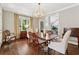 Formal dining room with wood floors, modern chandelier and traditional furnishings at 4750 Freeport Bay Ne, Roswell, GA 30075