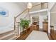 Spacious foyer features hardwood floors, a staircase, and a view into the living room at 4750 Freeport Bay Ne, Roswell, GA 30075