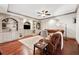 Inviting living room with hardwood floors, built-in shelving, and a comfortable leather sofa at 4750 Freeport Bay Ne, Roswell, GA 30075