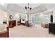 Spacious main bedroom with a tray ceiling, ceiling fan and plush carpet at 4750 Freeport Bay Ne, Roswell, GA 30075