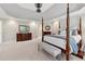 Spacious main bedroom with a four-poster bed and carpet at 4750 Freeport Bay Ne, Roswell, GA 30075