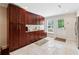 Spacious mud room with custom cabinetry, sink and tile flooring with natural light at 4750 Freeport Bay Ne, Roswell, GA 30075