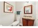 Charming powder room with hardwood floors and a vessel sink at 4750 Freeport Bay Ne, Roswell, GA 30075