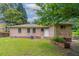 A spacious backyard featuring lush green grass and shade trees at 61 Springside Se Dr, Atlanta, GA 30354