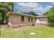 A wide shot of the backyard that features a flat, well manicured lawn at 61 Springside Se Dr, Atlanta, GA 30354