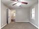 This comfortable carpeted bedroom provides a view into an adjacent room at 61 Springside Se Dr, Atlanta, GA 30354