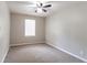 This bedroom is ready for you, featuring carpet and a ceiling fan at 61 Springside Se Dr, Atlanta, GA 30354