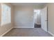 This bedroom is finished with plush carpeting and offers plenty of natural light at 61 Springside Se Dr, Atlanta, GA 30354
