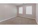 This bedroom showcases a neutral color scheme and plush carpeting for added comfort at 61 Springside Se Dr, Atlanta, GA 30354