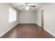 A bright bedroom featuring hardwood floors and a ceiling fan at 61 Springside Se Dr, Atlanta, GA 30354